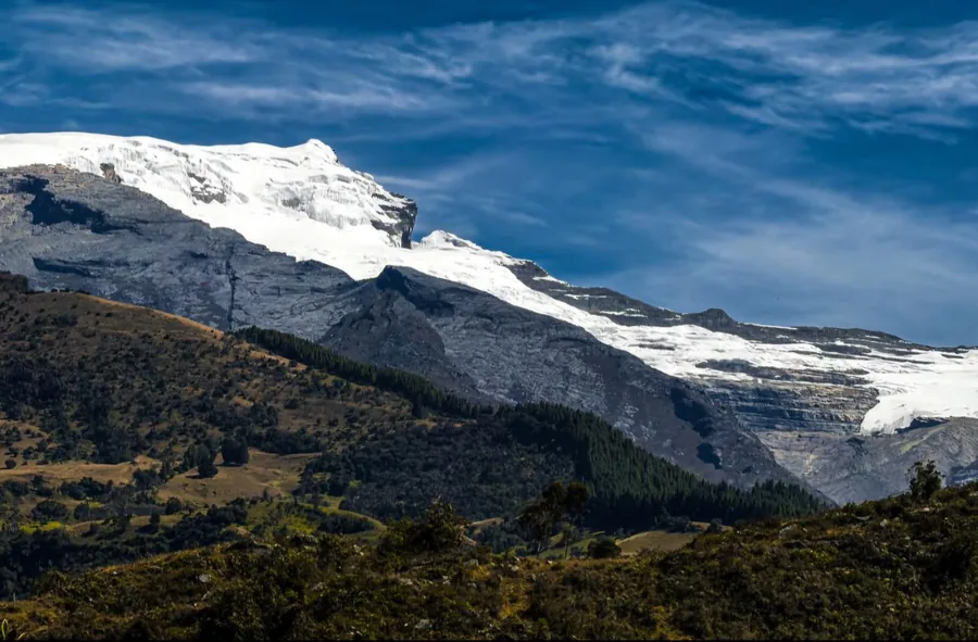 The Ritacuba Blanco glacier seen from the pastures of Güicán de la Sierra, the ice cap above the rock face